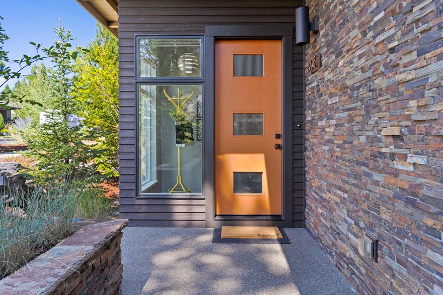 Gorgeous Mid-Century style contemporary home in Northwest Crossing. Built by Greg Welch Construction, this home has a high level of detail including Earth Advantage certification and beautiful custom finishes. 1946 square feet, 3/2 nestled on a remarkably private lot with a private back patio and hot tub. Beautiful kitchen with center island, side-by-side industrial freezer-refrigerator, instant-hot water, and large pantry. Generous Great Room with modern stone fireplace and large hearth. Second floor primary suite is a crow's-nest experience with windows that pour in light and the views of nature, complete with a rooftop deck and views of Pilot Butte. Zoned heating and cooling with Nest Technology and solar panels for maximum efficiency. Walnut and cork flooring. Mudroom/laundry off the two-car alley load garage. This impeccably maintained home is in a very established portion of NWX, close to restaurants, shopping and parks and close to all the Westside of Bend has to offer.