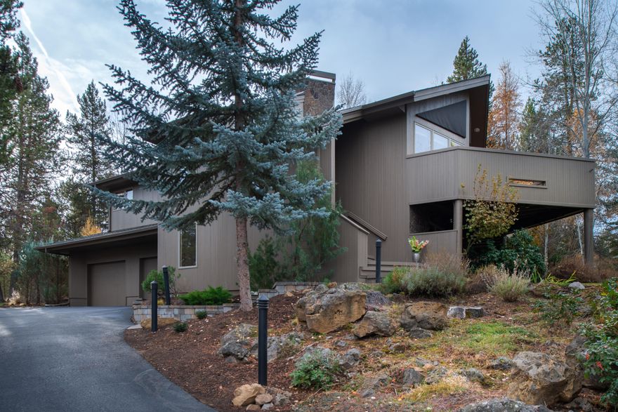 Meticulously maintained with many upgrades throughout. Backing to a large common space that offers privacy galore. Featuring landscaped area w/ calming waterfall, large paver patio & seclusion! Vaulted ceilings, large windows, open floor plan with gas, double sided fireplace, 2 dining areas, Hickory Hardwood floors. Generous Master bedroom suite with jetted tub & deck access.  Downstairs offers a 2nd Jr. Suite with a Jack n' Jill style bathroom. A third guest bedroom with private access to the back patio.  The oversized family room has a Heatilator gas fireplace with thermostat & full guest bathroom off the laundry room. Upgrades include Granite Counters, Furnace replaced 2017, A/C & hot water heater & Central Vacuum new 2018. Generous insulated oversized two car garage for all your extra stuff. Sink conveniently located in the garage.  Two zones for heating so each level has its own thermostat. Wired for hot tub off master bathroom.  SHARC paid in Full!