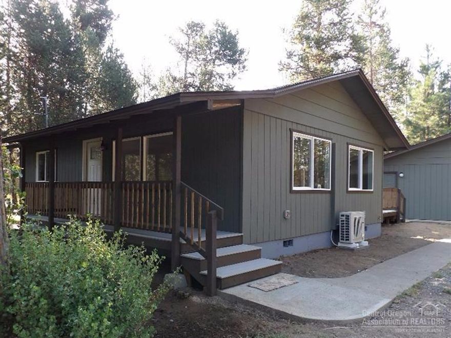 Charming 2/1 home hidden in the woods with Mt. Bachelor view from back deck and dining room. Home sits back from road for plenty of privacy. Right across street from National Forest. Detached 1 car garage with bonus room and bath. All new: paint inside & out, stainless appliances, cabinets & marble counter top in kitchen, laminate & tile flooring, Daikin heating/air conditioning system, insulation, windows, water heaters, roof, Trex decking on porches. Storage shed. Move in ready.