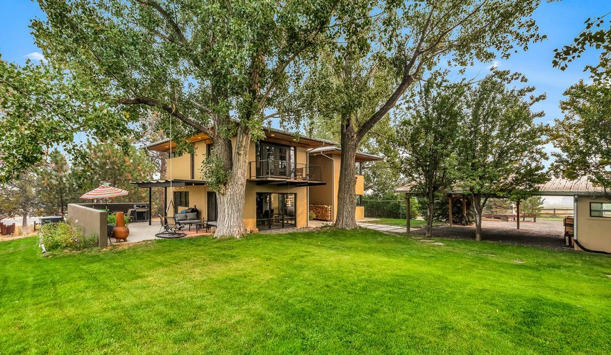Tumalo is the best of both worlds - space &                                                                                                                 peace around you, but only 10 minutes from downtown Bend. Passive solar home set among heirloom farmstead trees w/thoughtful nods to local history w/reclaimed timber from the Old Mill, hand-milled barn wood floors, and converted milking barn from High Mowing Farm. Radiant floor heat, masonry fireplace, thick storefront style windows keep you warm in the winters & cool in the summer. Surround your family around the large kitchen island, watch the sky from the farmhouse sink. Junior suite w/reading room, large mudroom w/full bath & laundry round out the first floor. Upstairs is a spacious master w/gas fireplace and deck (currently set up as a bonus w/peek-a-boo views of the Three Sisters), large remodeled bathroom, and two other bedrooms. Outbuildings include 4 stall car-port w/small shop, office/studio in the dairy barn.