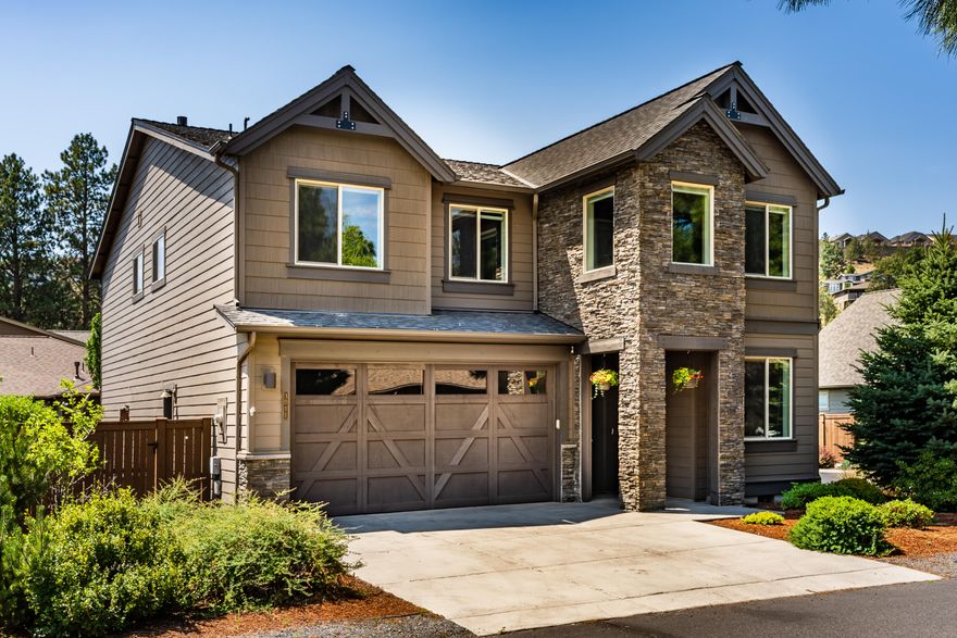 Move in ready Pahlisch home conveniently located at Rivers Edge. Offering an open floor plan, beautiful engineered hardwood flooring. Kitchen offers natural lighting with quartz counter tops, stainless steel appliances & pantry with ample storage. Dining area opens out onto large covered patio with shades for outdoor entertaining any time of day! Backyard also features a custom water feature, & hot tub. Primary bedroom features french door entry, soaking tub, beautiful tile work and custom closet. 3 additional bedrooms & a bonus room that could even be another bedroom or large office. Don't miss the downstairs office! It's the perfect set up for a family of remote workers! The outdoors is just out your front door with the river trail a block away, minutes to downtown, parks, & shopping.