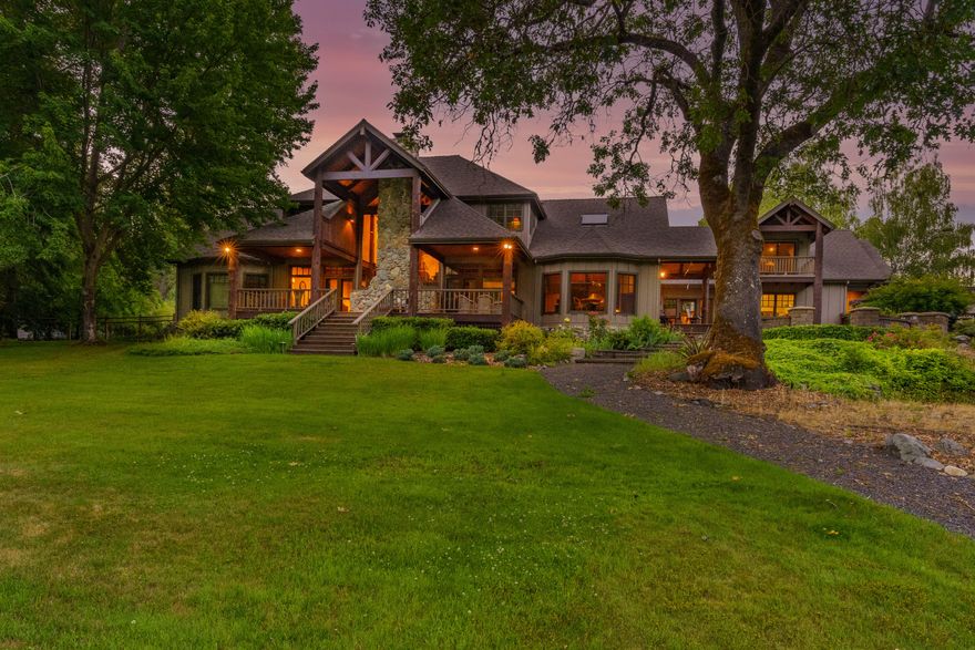Heart of Southern Oregon Wine Country w/ Applegate River frontage! Gorgeous private paved gated entry w/a Vineyard, over 1500 vines, fenced pasture area & fully irrigated w/ in-ground system. Stunning Lodge style home + 600 sq ft cabin, 4+ Car garage & shop. Lg open wood vaulted beam ceilings w/ floor to ceiling windows & doors! Dream kitchen w/ dbl ovens, 2 islands, wolf 6 burner gas cook top w/ convection oven, sub zero refrige, 2 dishwashers, 2 sinks, granite counters, skylights, 2 walk in pantries w/2nd refrige. Breakfast rm off kitchen w/ wall of glass & doors to back deck overlooking park like grounds & river. Formal dining rm. Great rm w/ lg stone floor to ceiling wood burning fireplace, open office area/den w/built ins. Master ste on main floor w/ 2nd wood burning fireplace, River views, 2 walk in closets, 2 vanity sinks, soaking tub, lg walk in tile shower w/ duel heads. Upstairs could be 4th bdrm w/ built-ins and balcony. Park like grounds w/ Gazebo, & fenced garden beds