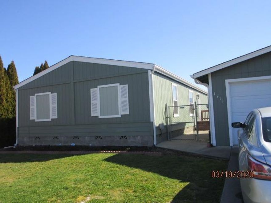 Wow! Affordable and available! 3/2, manufactured home with vaulted ceilings, super clean and move in ready. Master is separate with it own walk in closet. Extra insulation for warm and cozy living. Two car detached garage with room for shelving and extra storage.
