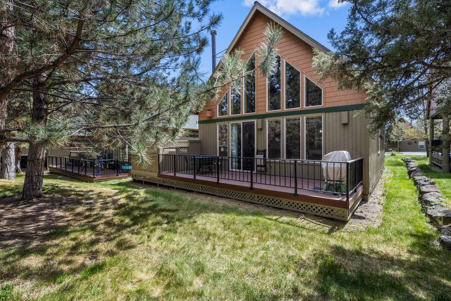 Don't miss your opportunity to own this classic chalet with unique qualities located in the popular golf community of Eagle Crest.  The light and open 3 bedroom, 2 bath, great room floor plan is the perfect retreat to enjoy all that Eagle Crest offers. Features include cathedral ceilings, stunning wood beams with iron work detailing, river rock gas fireplace, beautiful new vinyl floorings, and natural wood detailing throughout.  Upstairs has a spacious loft w/views and vaulted private primary suite with ensuite bath. Seller updates include new furnace & heat pump, new appliances, beautiful LVP flooring and carpet.  The home comes fully furnished turnkey ready for vacation rental or buyer to enjoy. Compare this Chalet to the others, it is a standout!  Enjoy the EC amenities; gym, pools, biking, hiking, golfing and resort living. Assumable seller carry option available! HOA installing New roof in 2025.