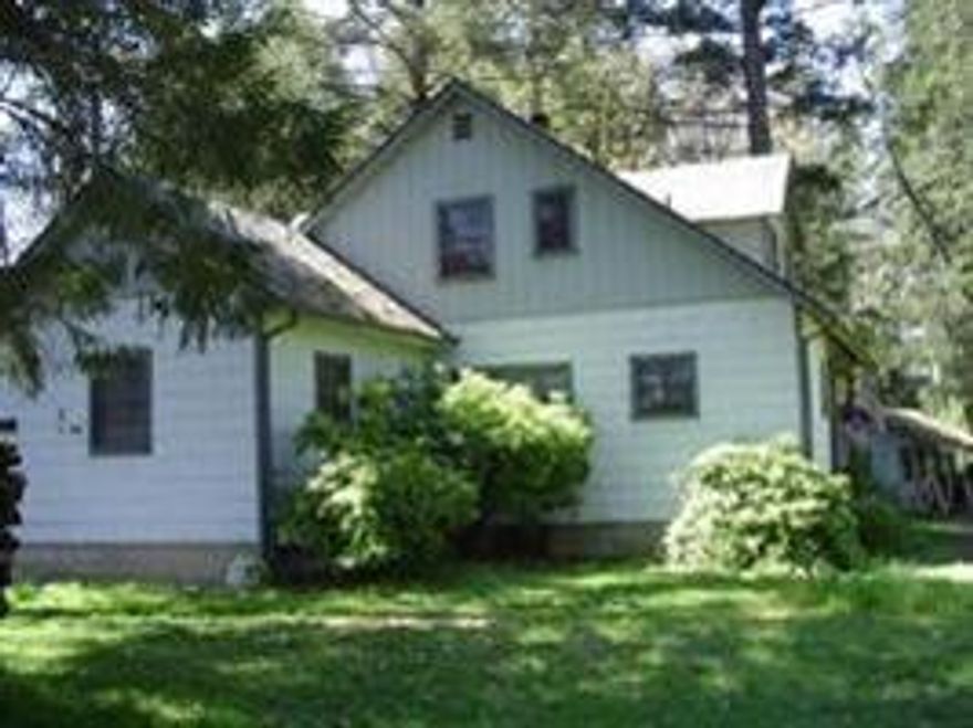 Great opportunity to purchase this beautiful 7.81 acres w/over 400 ft. of the famous Rogue River frontage. Enjoy the lodge style home built in 1946 with rock fireplace. Detached garage and additional outbuildings. Property is zoned R1; may be possible to divide into 2 riverfront lots. Buyer to do due diligence regarding split of property into river lots. Bring your fishing pole!