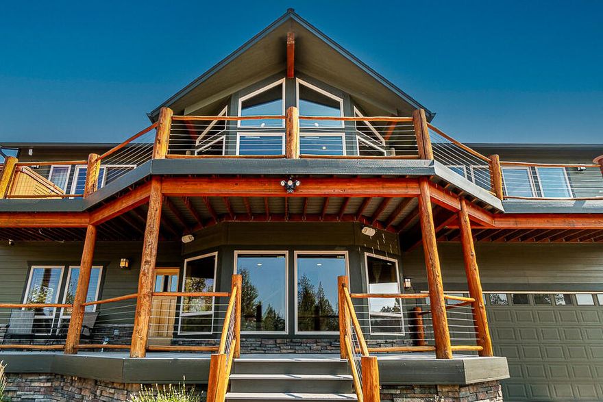 Cascade Mountain Views and Privacy on this quiet, 9.25 Acres Lot and a beautiful Custom Home. This 4 Bedroom home has 2 Bedrooms down and 2 up. The 4th Bedroom being used as an Office. The Open Kitchen to Living Room #1 has newer Stainless Steel Appliances, including a Sub Zero Refrigerator, Alder Cabinets, Granite Counters & Hickory Wood Floors throughout. The Master Suite has a Jacuzzi Soaking Tub inside and a Hot Tub on the adjoining deck. Beside it is Living Rm #2 ''The Library'', with a Wood Burning Fireplace, Built in Bookshelves and Library Ladder. A cozy room overlooking the Cascade Mountains and the Small Pond Water Feature below. Decks front and back, newer Heat Pump added for greater efficiency and a Water Softener. Downstairs, the 2 guest rooms have Living Room #3 for their privacy. This amazing View Lot is on a corner, no neighbor in sight. The Property is Fenced and Gated, ready for your country life - horses, dogs and chickens yet only 9 miles from Downtown Bend.