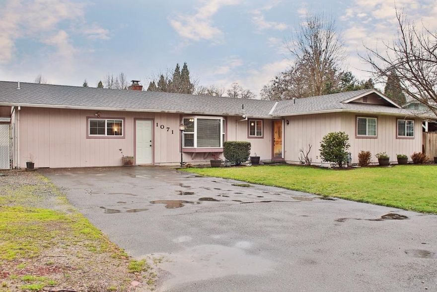 Lovely updated Ranch style home, 1760 Sq. Ft. 3 bedroom 2 bath is move in ready! Large foyer welcomes you with access to a bonus room that has a storage area or could be pantry. Dining area has bay window, kitchen is light and bright! Spacious living room has wood burning fireplace with brick hearth. Beautiful wood laminate flooring sweeps through out home except bedrooms and baths. Master bedroom has two closets with en suite. This home offers a lot of storage! Sliding glass door from living room opens unto covered cement patio in fenced back yard with room for a garden. 2 car garage located behind home is insulated and can be accessed from driveway & side gate. RV parking area located behind gate on side of home. All on .23 acres Close to all City services.