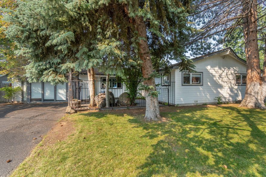 Must see home! This beautiful home sits on large corner lot in desirable NE Bend neighborhood. Close to park, schools, shopping. Home has 4 bedrooms, 3.5 baths with two primary suites. Large kitchen with lots of storage and pantry.  Breakfast nook and dining room. Formal living room with fireplace. Bonus room with half bath and plumbed for wet bar. Many interior updates, including Red Oak 1 flooring. New exterior siding and paint. Furnace and water heater replaced in 2020. Approved for ADU and short-term rental. Buyer to complete all due diligence on property uses. Large lot has amble room for garage to be built.