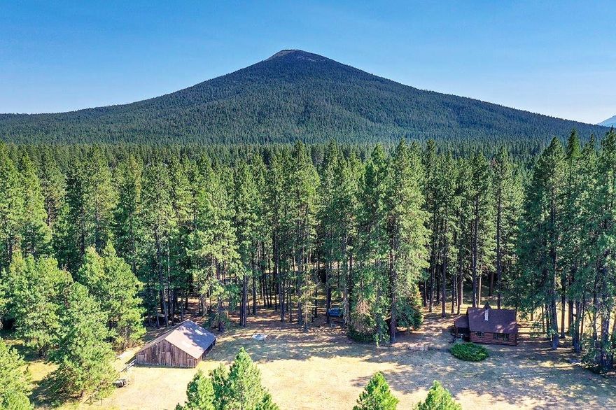 Historic Luther Metke log cabin on 8 acres in a beautiful meadow setting shaded by mature Ponderosa pines and fir trees. This is truly a ''once in a lifetime'' opportunity to acquire a very rare large acreage in the Metolius Basin. The rustic cabin is filled with character and ready for immediate enjoyment with three bedrooms, two baths, 1,656 sq. ft., a rock fireplace, hand peeled log beams and knotty pine paneling. Horses are welcome and the property has a great barn and fencing in place. National Forest and the Windigo Trail is nearby. The property is served by a private well, electric service, septic system, water rights and a paved county road. Act now to secure this rare piece of heaven on Earth. Close to the Metolius River, National Forest, Hoodoo Ski Resort, Black Butte Ranch and a short drive to Sisters. Hike, mountain bike, horseback ride and cross-country ski out your back door.