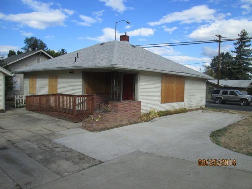 Investment Opportunity!Your chance to own a great corner on a major street in Medford. Home has been converted to an office and has paved parking. Perhaps can change back to a home. Buyer to do own investigaton. Needs a bit of work but this is a great deal for the price