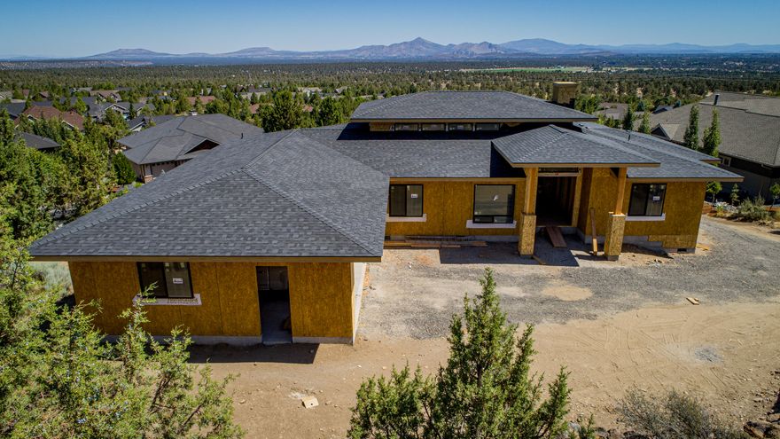 Single level 2,768 square foot home, PLUS an additional 800 sq ft flex space with incredible views of Mt. Jefferson, Mt. Hood, and Smith Rock now under construction in Eagle Crest Resort!  Open concept floor plan featuring 3 bedrooms and 2.5 baths with a separate office and a bonus/family room. Great room with 16' foot ceilings, transom windows, and gas fireplace.  Gourmet Kitchen with slab quartz counters, huge island with breakfast bar, gas range, stainless appliances, and soft close cabinets and doors. Master suite with soaking tub, tiled walk-in shower, slab quartz countertops, dual vanity, and spacious walk-in closet. Huge raised paver deck is perfect for entertaining or enjoying the sunset. Private setting backs to Cline Buttes. Bonus 50' x 16' finished tandem garage below deck. 800 sq ft with endless possibilities.  Workshop/Man-Cave/Home Gym/Classic Car parking. Landscaping included. Another outstanding home by Ken Thomas Construction.