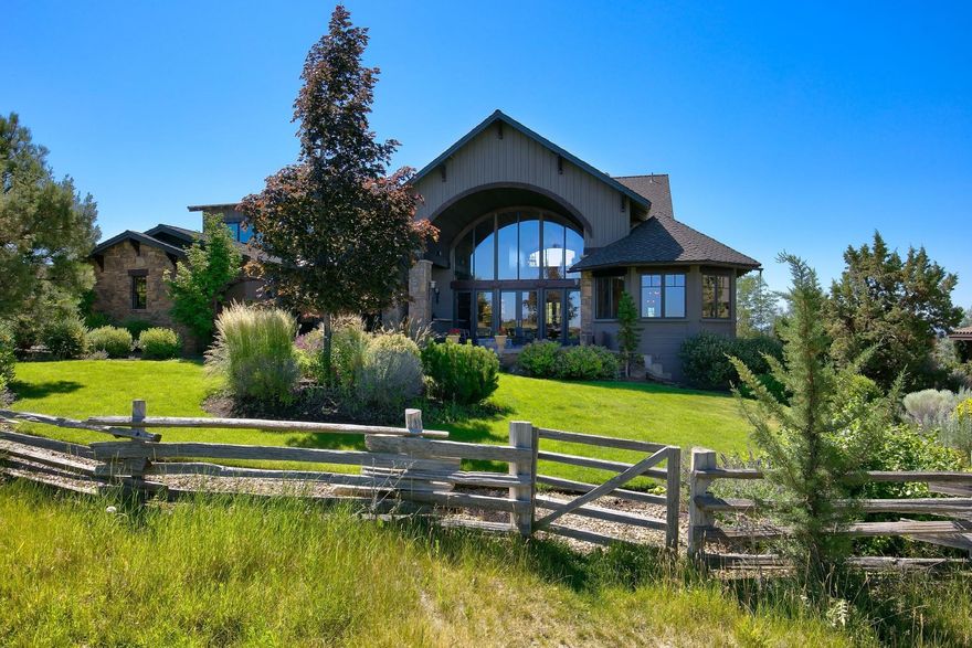 Both unique and elegant, this NW style home sits above the 13th fairway of the Brasada Ranch golf course, with a backdrop of the Cascade Mountains. Perfect for entertaining, the home features an inviting covered patio with a barrel vaulted ceiling & gas fire pit. The great room has a majestic rock fireplace, vintage reclaimed fir ceilings, & wide plank oak floors. The open kitchen and breakfast area has solid granite work areas, a large island, bar, custom cabinets, and a clever butler's pantry. Dining room with fireplace, master suite and office are on the main; bonus room and two bedrooms are upstairs. Designed by renown Architect, William Harrison, built by Black Rock Construction, a Tour of Homes winner, the home features exquisite details and finishes. Certified with Earth Advantage's high efficiency requirements. Fenced rear yard. Enjoy community amenities - world class golf, equestrian facilities, Athletic Center with pools, fitness & tennis, walking trails & restaurants.