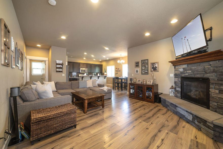 This newer 3 bedroom, 2.5 bathroom craftsman style home is in a community oriented neighborhood. Home features upgrades such as quartz counters throughout, central heat/air conditioning, gas fireplace surrounded by gorgeous stone and solid wood mantle, vaulted ceilings in entryway, double vanities in both full baths, high end beautiful laminate flooring downstairs, carpet upstairs. Loft upstairs can be used for guests, as a play room, an office-so nice to have the extra space. Community pool, park, & playground is a huge plus. Easy access to store and schools. This house is absolutely turn key ready so let us know when you can move in!