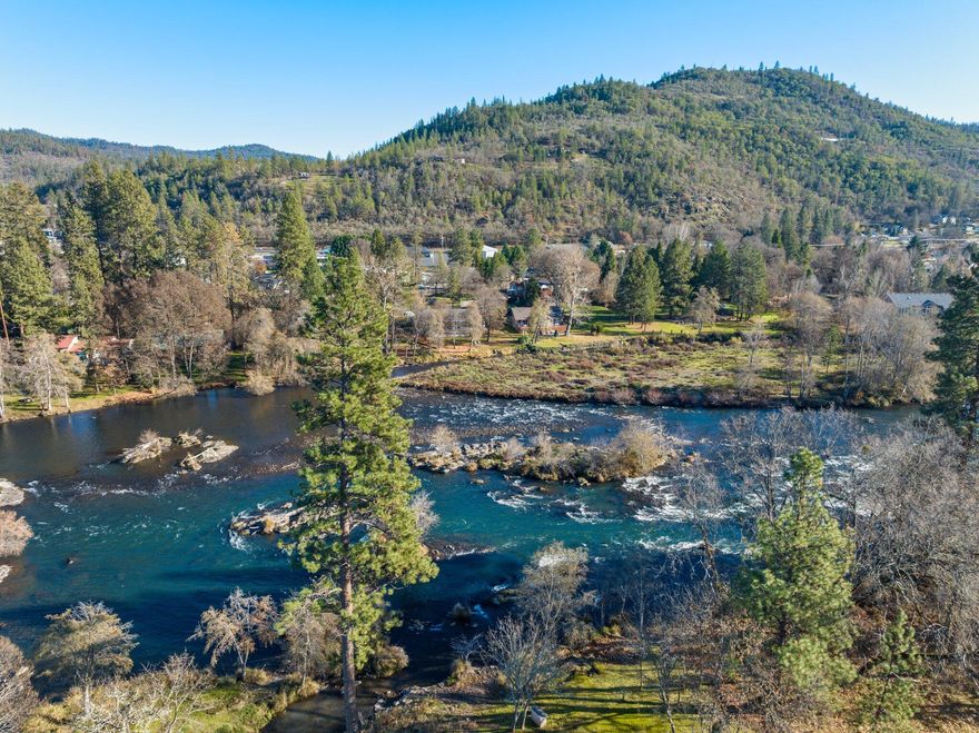 Meticulous turnkey home. Seller invested $500k+ in upgrades. Kitchen Remodel in 2020 w/ Stone Counters, Custom Cabinets, Knotty Alder Pantry Door, High-End Appliances-Wolf Thermador Bosch Sub Zero. NEW Primary Suite w/ Spectacular Rogue River & Mtn. Views incl. cedar ceiling, bath w/ 2 Vanities, Soaking Tub, Cave Shower & XL closet. 2 addt'l ensuites & 1 bd/office, baths w/ NEW Stone Counters. Heated Tile Floors, Full Laundry, Central Vac. Other Upgrades Incl: Blacktop, Sided 50'x30' RV Garage, Keyed Entry Gates/Fencing, Ductless Heat/Air, LED Lighting in/out, Window Coverings, Ceiling Fans, Cabinet/Door Hardware, Keyless Entry, Security System, Decking, View Railings, Paint in/out, several 220V (EV/RV) outlets. Relandscaped w/99 New Trees. Tons of nat. light, solarium w/wood stove, XL pic. windows. Approx 5-min to fishing/rafting/grocery/gas, 30-min to Costco, SC airport w/helipad-blocks away. Orig. 2 parcels - potential ADU.
