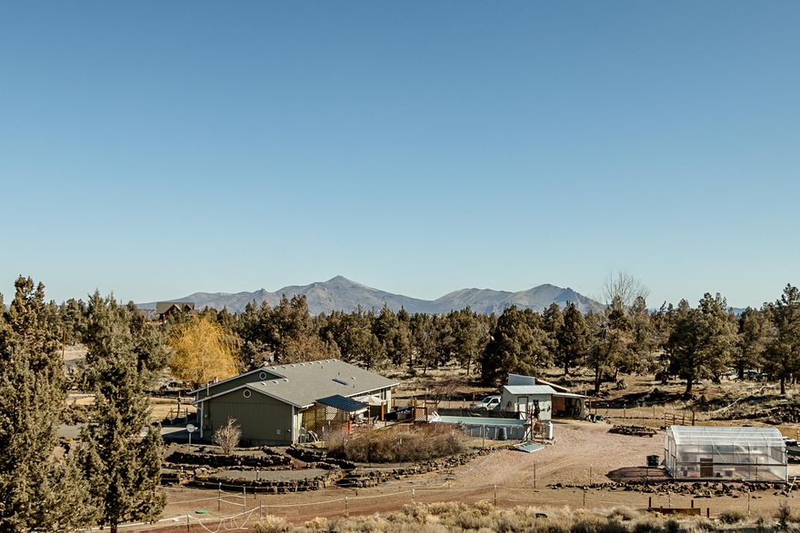 Come see everything this charming property has to offer! Great single level ranch home with vaulted ceilings. Updated flooring, kitchen, interior paint. Soak in the beautiful views of the surrounding terrain from the above ground heated pool, or relax in the spa as you enjoy the open solitude of the 4+ acres. Multiple outbuildings, Tuff Shed, steel shed, tack room with hay storage, greenhouse, horse stalls, water feature in front yard, zone sprinklers, canine agility course. Newer water heater, upgraded A/C, private well with newer pump and pressure tank as well as a Kinetico water filtration system. This property is ready for you to bring your hopes and dreams to the Central Oregon lifestyle!