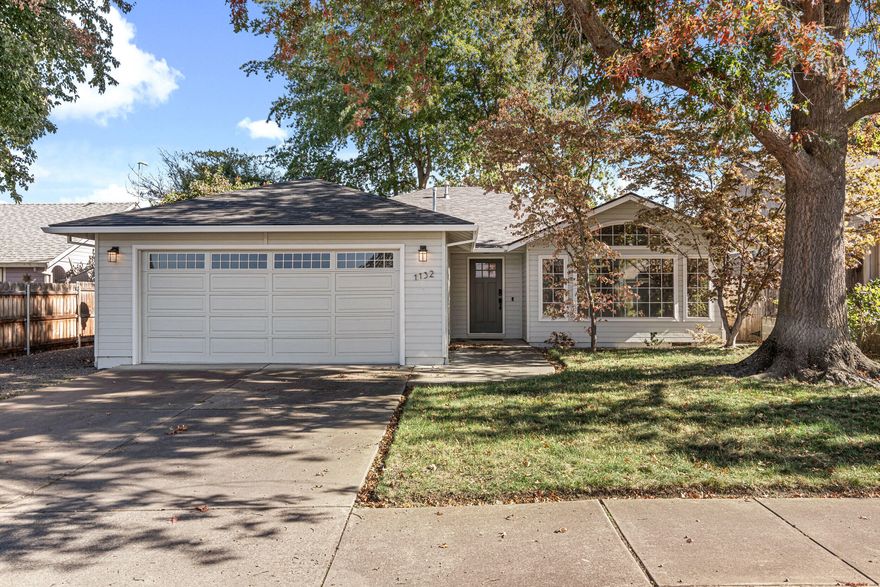 Beautifully updated 3 bdrm/2 bath, single level home offering 1,550 sq.ft. comfortable living. The open-concept layout features vaulted ceilings, ceiling fans, and a cozy woodstove, creating a warm and inviting atmosphere. Enjoy a remodeled interior with stunning bathrooms, thoughtful upgrades, and a newer roof for peace of mind. The spacious kitchen and living areas flow seamlessly to the fully fenced backyard with mature shade trees and a covered patio - ideal for outdoor living. Plenty of parking adds convenience, while the prime location keeps you close to everything. A well-kept, move in-ready home that checks all boxes!