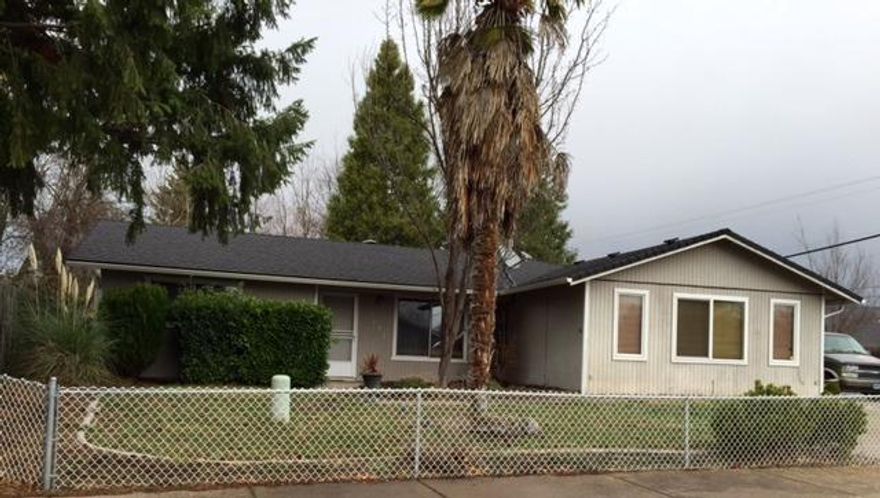 This East Medford home is patiently waiting for its new family. It sits in a great location, only 2 blocks from the Rogue Regional Medical Center. In 2007 the owners replaced the roof, put in a nice deck and in ground lagoon-style pool. The interior has been partially updated and is ready for you to complete it with your own personal touches. It would also make for a good investment.