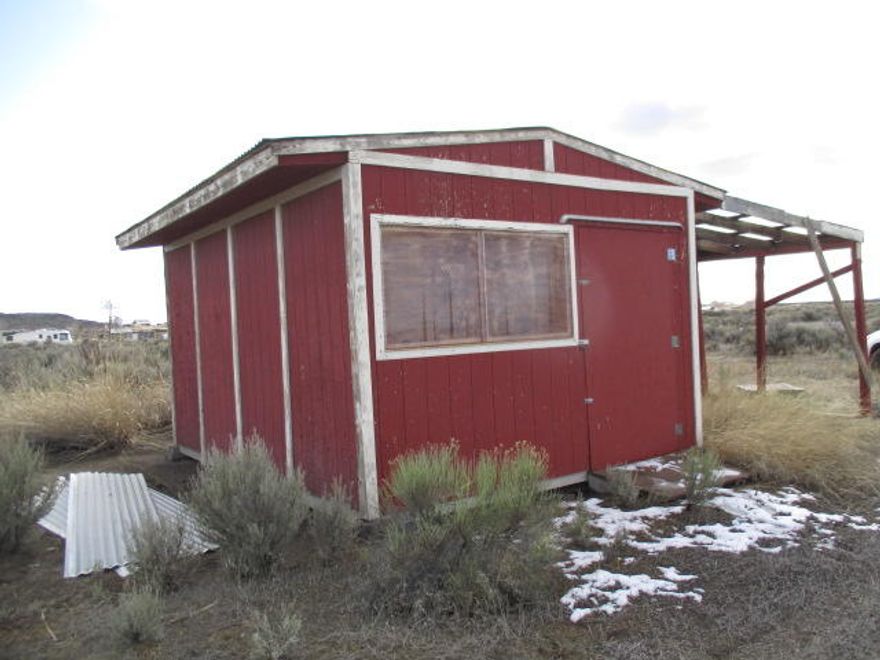 Great place to build a nice home or cabin.  Theres a nice storage building on the property too. This 2.43 +/- acre property  not far out of town so you don't have far to go to get supplies, groceries, gas and more. Water is at the back of the property for buyer to have connected. Enjoy the high desert and all the beauty there in.  The area is served by multiple restaurants, hardware store, grocery stores, gas station, gift shops, library, park, golf course, sports/tennis court, a clinic, EMT Services, credit union, and more. Great time to invest in the future for a great get away!