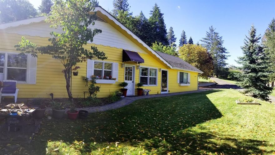 Country living in the heart of the Rogue Valley! Centrally located within just minutes driving distance to some of the most sought after local favorites and tourist attractions in the valley, including vineyards, theatre, entertainment, and much more. This remodeled cottage-style home on sits on nearly two TID irrigated acres of lawn and potential garden space. The house has large windows with open floor plan that offers plenty of natural light throughout the entire home. The house has recently been updated. Tile counters in the kitchen, newer laminate floors, recently painted, and extra closet space in the master bedroom, with lots of nooks and crannies to personalize. A large 550 sf 2 car garage has RV parking beside it w/ electric hookups and a new deck built for a hot tub that takes advantage of the views. Don't miss the storage in the full-sized attic of the house or the playhouse up the hill. Call your favorite Realtor for your personal viewing before it's gone!