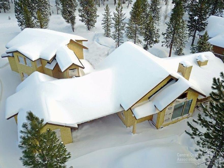 Spectacular new home under construction. Level .41 acre western facing lot with peak-a-boo views of Mt. Bachelor. Home site backs up to large common area and trail leading to resort amenities. HOA fees include pool, tennis , golf, parks, playground, owner's events, bike paths, stocked fishing lake and kayaks and canoe.