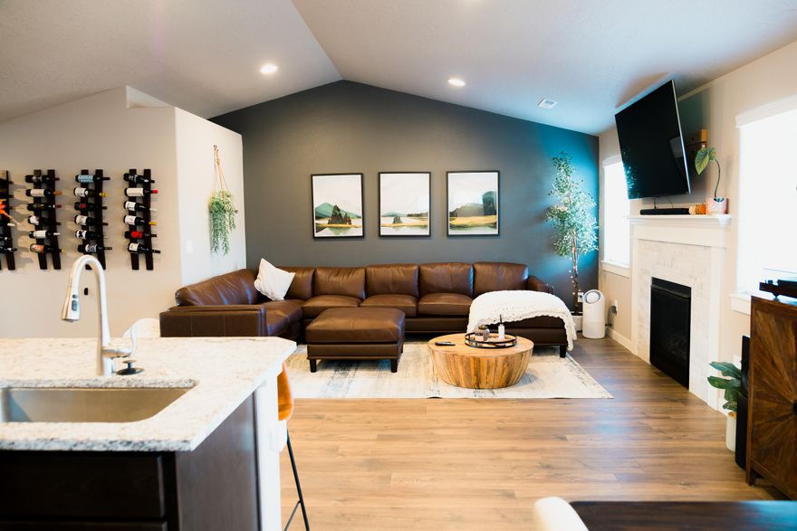 Discover easy living with neighborhood access to Redmond's beloved Dry Canyon Trail. This nearly new mid-sized home is 1,408 sq. ft. and offers a smart, open-concept layout designed for comfort and connection. The vaulted great room seamlessly blends the kitchen, dining, and living spaces ideal for relaxed entertaining or quiet evenings by the cozy fireplace. Enjoy privacy with a split bedroom design, a spacious primary suite with dual closets and dual vanity bathroom. Enjoy high quality granite countertops with LVP flooring throughout the main living areas. Step outside to your covered patio, complete with a hot tub, privately fenced covered patio, and a low maintenance backyard that enhances the daily living this home provides. Equipped with a two car garage, modern finishes, and unbeatable proximity to trails, parks, and town conveniences, this home delivers the ideal Central Oregon lifestyle while being move-in ready and priced to sell.