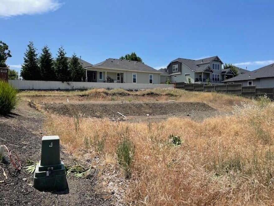 This is the perfect place to build your dream home!  Located in Aerial Heights Subdivision in East Medford, just off Cherry Lane.  This large lot has beautiful views and is ready to build on.  Excavation is done and the building pad complete!  The lot is wide enough to allow room for RV parking or a 3-car garage house plan.  Not far from schools, shopping and medical facilities.