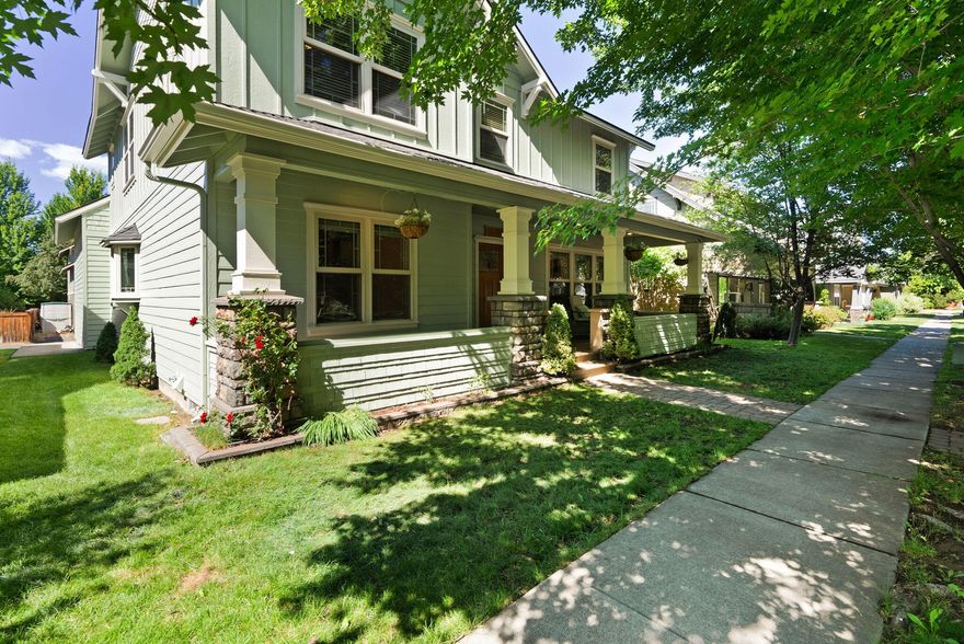 Experience timeless style and modern comfort in this beautifully updated Craftsman home in NE Bend. The inviting living room features abundant natural light and a cozy gas fireplace. The spacious kitchen boasts alder cabinets, tile counters, stainless steel appliances, and a large pantry, while the formal dining room with cherry wood floors adds classic charm. Upstairs offers 3 bedrooms, 2 full baths, and a spacious bonus room—ideal for work or relaxation. The primary suite includes a walk-in closet, jetted soaking tub, travertine floors, and a tile shower. Enjoy new paint inside and out, new carpet, A/C, and a 2-car garage. The covered front porch and private back patio overlook landscaped yards with sprinklers. Conveniently located near parks, shopping, schools, and top Bend amenities, this move-in-ready home on a tree-lined street offers exceptional value and style.
