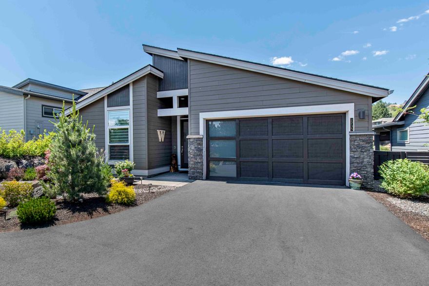 This Pahlisch built gem offers a peaceful setting and low maintenance living. Nestled conveniently close to shopping and the trail system, you'll have everything at your fingertips. The single level Carrera floor plan, designed to be open & versatile. The primary bedroom is thoughtfully located in the back of the home, providing privacy & tranquility & views. Two add'l bedrooms are situated at the front. The great room features a gas fireplace & plenty of built-in's. This space flows into the gourmet kitchen & dining area, featuring a large center island w/ a breakfast bar & dry bar area.  Indulge in the serenity of nature from your west-facing deck, overlooking the golf course & a charming water feature. This beautiful setting sets the stage for outdoor entertaining at its finest. Luxurious features abound in this home, including stone countertops & tile showers. Every detail has been carefully considered to create an inviting & elegant living space.