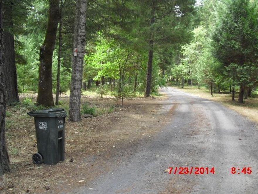 Tranquil and peaceful. You can breathe on this beautiful 4.90 acres with a 1986 3 bedroom (split design), 2 bath, 1568 sq. ft. home. Nice deck on front porch overlooks the property. Gated at the entrance, with a 12x14 shed and detached garage. There are 2 usable wells (1 for pasture and 1 for household). This property has plenty of room to spread out.