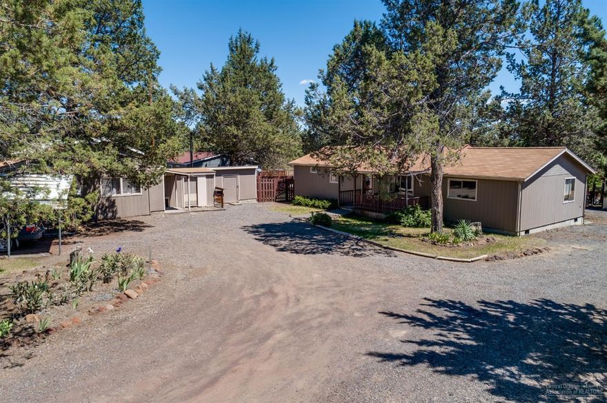 Great stick built home on 1 acre in Crooked River Ranch. This home has 2 good sized bedrooms with a living room and family room, 2 bathrooms and tons of built in storage. Family room could be converted into a 3rd bedroom. Large covered deck out back overlooks the fenced off back yard with beautiful mature trees. There is a separate fenced off area that has been used for a garden. Plenty of space for animals. 807 SF shop is plumbed for bathroom and has electricity. There is also a 140 SF attached tool shed, 120 SF garden shed and a carport.