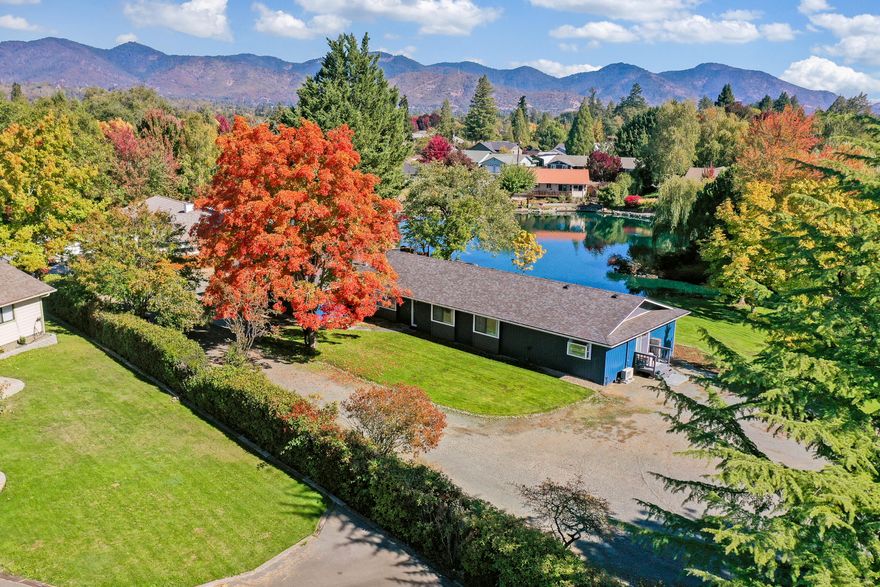 Nestled among the mountains and just steps from the Rogue River sits this beautifully updated family home in the most picturesque location imaginable. Soaring mature trees and a sparkling
pond set the scene and welcome you home. From the moment you step inside, you're greeted with fresh paint, designer flooring and tons of warm natural light. An effortless flow guides you through the living and dining spaces and into the large kitchen with plenty of room for the
home chef to flex their skills. Just down the hall, find three bright and spacious bedrooms before you run into the sprawling GUEST SUITE that boasts a private entry, kitchen and ensuite
bath. There's so much more to see in this incredible home on 1+acres– call today for more info!