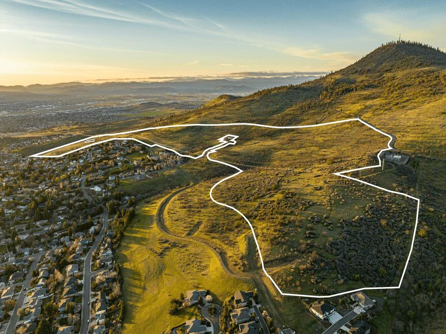 An opportunity to own 1% of the total land area of Medford, Oregon - welcome to The Highlands. 167-acres on one tax lot, The Highlands is tucked in the East Medford hills & commands the most desirable location & views. Ideally situated for a luxury development site, there is a grandfathered PUD laying out 800+ units of detached SFR, condos, & townhomes as well as senior living facilities & multifamily sites. Developers could utilize The Highlands to deliver a market-defining project. Combining world-class views with convenience, each residence located within The Highlands will be <10 mins to grocery, dining, Asante hospital, recreation, & <15 mins to RV Intl. Airport & I-5 access. Sharing a property line, Prescott Park offers 17+ miles of public trails next door. Utilities are stubbed/close, believed to have adequate capacity for the first few phases of development. Take advantage of great demographics and a growing market with The Highlands! Buyers to complete all due diligence.
