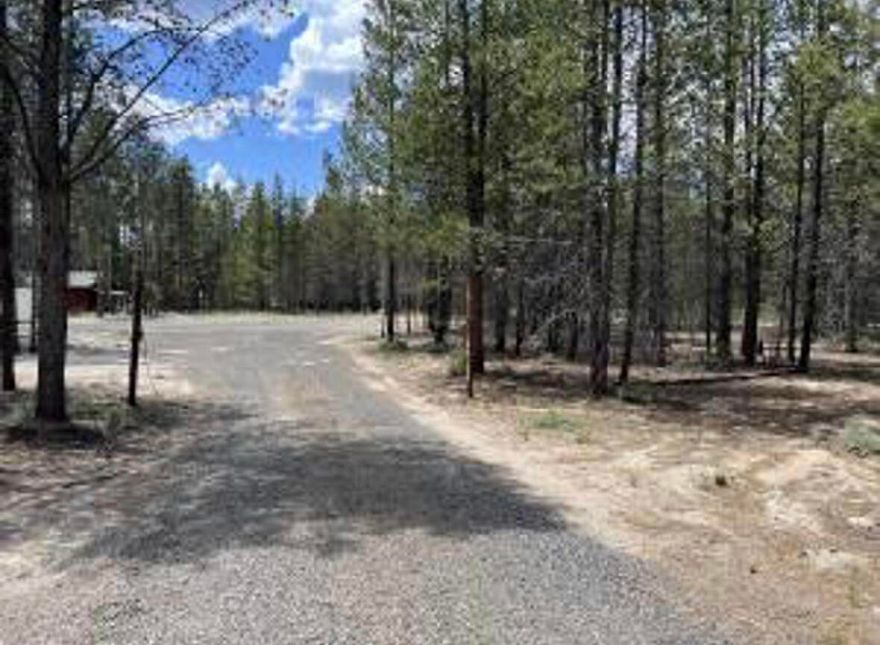 This 1.1 acre lot is in a prime location in one of the fastest growing towns in Central Oregon. The lot has been cleared of the majority of the trees and ready for you to build your dream house. Includes a 12x16 shed. Owner will carry with 30% down and rate based on credit and details to be agreed upon between buyer and seller. The insulated 40' shipping container is sold separately.