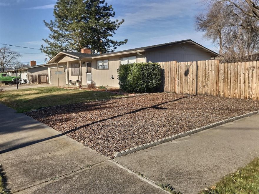 Don't miss this adorable home nestled in a lovely East Medford neighborhood, close to shopping and many other amenities. This home is located on a large corner lot with plenty of parking, including room for your RV! The home features a cozy fireplace, stainless steel appliances and two car garage. Plenty of space for gardening, a pool and entertaining. Make an appointment to view this home today, it won't last long!