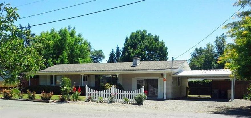 Very charming home at the end of a quiet street that has been lovingly cared for by its only two owners. Home, yards and gardens have been meticulously maintained. The back yard is fully fenced for privacy with a covered patio and the front has a long covered porch. Inside are 3 spacious light filled bedrooms and one bath. There is a heat pump but it still has the baseboard units that have been disconnected. A lovely wood burning fireplace in the living room warms the cold winter nights. Newer roof (2012), easy care vinyl siding, extra insulation, and double-paned windows. Seller will provide a home warranty and there is a Seller owned security system.