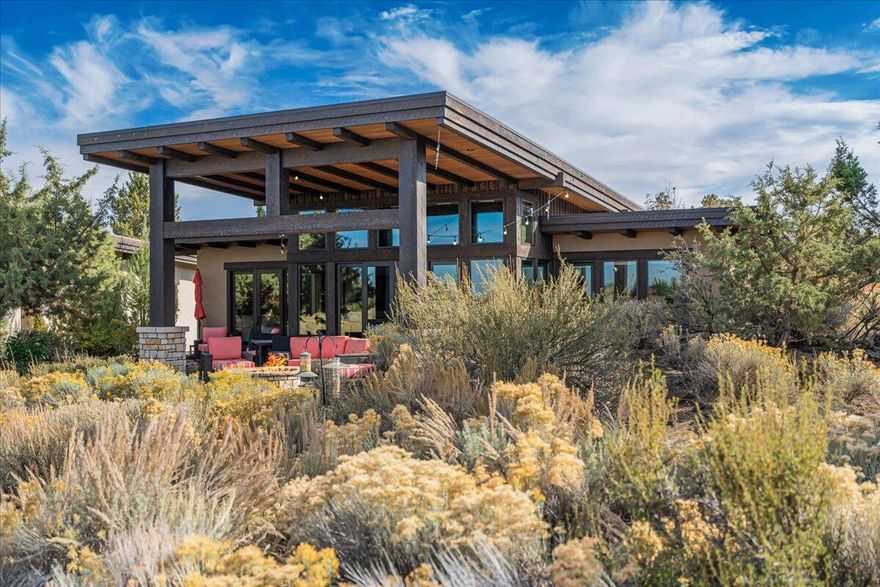 The Four Peaks community at Juniper Preserve overlooking the 18th Fairway of the Fazio course & Cascade mountain views. Built in 2016, this contemporary, mountain modern designed by Rick Wright offers a level of luxury for High Desert living. Offering an open concept great room with a floor to ceiling stone surround fireplace & clear story windows to enjoy the west facing views of the lake and mountains. soak up the natural lighting and large patio doors opening to a paver patio, fire pit, and built-in BBQ. Thermador appliance makes this kitchen perfect for preparing a chef's meal. New carpet in the bedrooms & custom touches throughout! Enjoy all the amenities at Juniper Preserve! 36 holes of Championship Golf on the Fazio & Nicklaus courses, Troon golf benefits, Private Members Club, Restaurants, on-site Market, Day Spa, Pools & Hot tubs, Fitness & Wellness Center, Staffed 24-hour Gate, Pickleball, Dog Park, trails and access to public lands. STR option & Membership included.