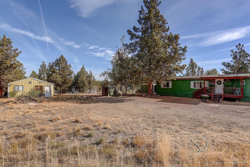 Motivated Seller! Rare opportunity in Tumalo! Cozy 3bd/2bth manufactured home on 1.34 acres of quiet country setting on a dead-end road. Shop/flex space ready for your projects, rv hookup, wood shed, carport & chicken coop. Great investment potential, or perfect for a first-time homebuyer. Fresh paint, new windows, updated flooring, certified wood burning stove, walk-in tile showers in both bathrooms & a mud room w/separate entrance. Bring your toys, horses & imagination! A true gem, waiting for a little polish & shine!