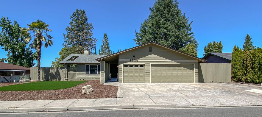 This classic East Medford home offers over 1700+sf, 3 large bedrooms PLUS an office, 2 full bathrooms, and an attached 3-car garage! Large .23 acre lot has small RV parking and a shed. You'll love the low-maintenance Syn-lawn turf and palm tree in the front yard. Backyard boasts a large deck and privacy with mature trees. Owners have paid attention to every detail to make sure this single-level home is fully wheelchair-accessible with ramps in the front and back and brand new sit-in shower/tub. Updates within the last 5 years include roof, water heater, furnace, appliances, brand new laminate wood flooring, and exterior/interior paint. Lots of options with this beautiful home! All appliances included.