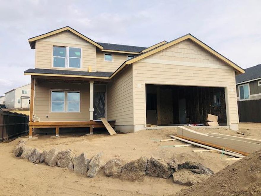 Quality new construction with an .21 acre lot, RV parking, plus mountain views.  Yes please!  This open floor plan has 3 bedrooms 2.5 bathrooms with an additional home office off the entry.  Finishes include a gas fireplace, A/C, solid quartz counters, hard surface flooring downstairs, and many upgrades throughout.  All bedrooms are upstairs.   The spacious backyard comes fully landscaped.  Completion date will be late April.