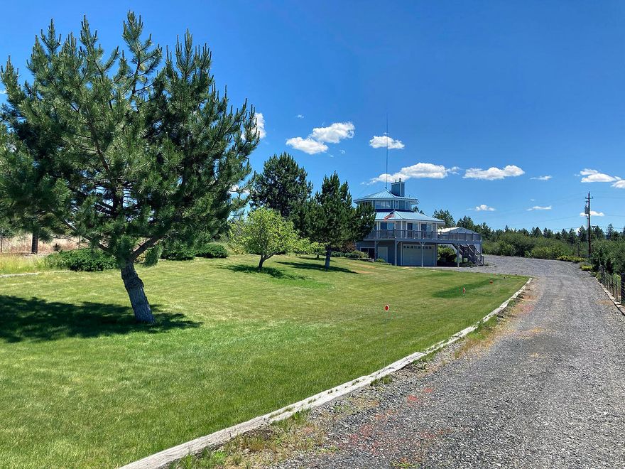 Seller will look at any/all back up offers. This custom home has gorgeous view of the cascades, this 1.57 acre of land sits on a well manicured yard with a huge workshop, bathroom w/shower, workbench with space for an RV. Entering this 2300+ft home you head upstairs to a 360 degree cupola/view. Below we pass a bathroom, bedroom, and office able to be turned into a 4th bedroom. The master bedroom has a custom bedroom set, walk in closet and large spa like bathroom. The open space living room is lined with 5 sliding doors leading into a large deck w/view great for BBQ's. The kitchen has custom cabinetry, a double sink and appliances, laundry room with washer/dryer and pantry. Downstairs there is a bathroom w/shower,bedroom,2 car garage and workspace. This amazing home sits on top of a hill with great views, split ac units, solar system, radiant heat 3 wood fire stoves, automatic propane generator all inside a safe and secure gated residence