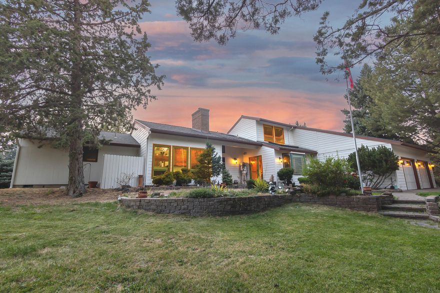 Seller is ready to move!! This exquisite, custom-built home spans 3,968 square feet, providing a tranquil and private retreat. The main-level master suite is impressive, while the spacious upstairs suite includes a vaulted ceiling, deck, and loft area. The layout makes for great guest quarters or multi-gen living. The gourmet kitchen has a large open layout with granite countertops and oversized island. Refined wood flooring, vaulted ceilings and great separation between usable spaces. The exterior boasts a picturesque setting with a gazebo, detached garage/workshop, pole barn, RV parking, a fire pit, hot tub, and peekaboo views of the Cascade Mountains. Fully fenced and accessed by a front gate, this property offers unparalleled privacy and tranquility. Discover the beauty and serenity of this remarkable home for yourself!