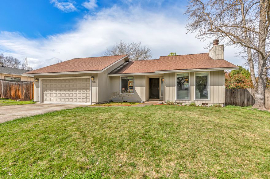 Nicely updated and well maintained single-level home on a large lot in an established neighborhood of East Medford - near parks, schools, medical centers, shopping, and restaurants. Home features waterproof vinyl plank flooring, custom tilework, wood burning fireplace, formal dining room and informal dining area with sliding glass door to back patio, kitchen with stainless steel appliances including a four-burner electric range oven, two guest bedrooms with closets, full guest bathroom with tub shower, primary bedroom with sliding glass door to backyard, walk-in closet, full ensuite bathroom with shower, and two-car garage. Fully fenced back yard with mature trees and sunny gardening areas, gravel side yard and RV or boat parking area. Recent improvements include all new rigid metal ducting, heat pump, and water heater. Inquire for details!