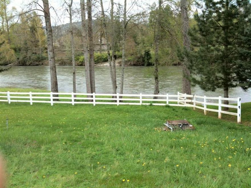 Beautiful one of a kind flat to gently sloped GPID irrigated .86 acre parcel with frontage on the Rogue River. Build your dream home on this great one-of-a-kind building site on the river. There is already a white vinyl fence on three sides. The other side could be easily fenced as well. Enjoy the 40 Gallons per minute output from the existing well.