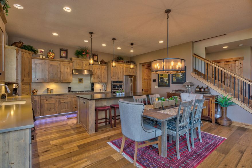 Newer townhome in Points West gated community just minutes from downtown Bend with quick access to Mt. Bachelor, the Cascade Lakes, and endless trails for biking/hiking. Serene view from built in firepit on paver patio overlooking lava canyon and the Deschutes River. Chef's kitchen with s.s. appliances, including island with sink. Master on main with two en suites upstairs provide excellent accommodations for gatherings and overnight guests. Expansive bonus room upstairs with direct access to spacious deck. One of the larger lots in development and among only a handful situated next to a beautiful canyon. Spare downstairs bedroom with French doors could be used for den/office. HOA provides all landscaping. Listing Agent is related to Seller's.