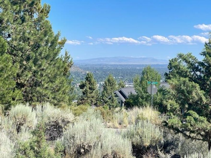 Awbrey Butte at its best! A beautiful corner with a sloped side to enhance views. This .49-acre lot is one of the largest in the neighborhood and offers easterly views of the Ochocos, Paulina, City, and Pilot Butte. The community also provides access to a park and tennis courts. Build your dream home in the premier neighborhood of Awbrey Butte, with utilities available at the property.