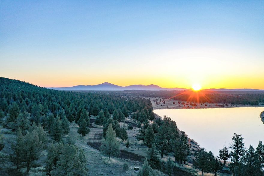 Welcome to Boulder Lake property, a prime agricultural, residential and recreational property with Smith Rock views to the east and the Cascade mountain range to the west for that majestic big sky feel. Situated between Redmond and Sisters on very private 206.35 acres with over 127 acres of certified groundwater rights, fertile and highly productive farm ground boasting a 120+acre pivot, currently with alfalfa and 3 private wells. The property is comprised of 3 tax lots and offers potential for 3 homes, CUP's in place and ready to build, underground utility at the building site, in addition to the 4bed/2bath existing home. All 3 lots border 520 acres of BLM land. Build your dream home on the 6+/-acre, 23+/- ft deep lake and catch trophy trout at your leisure, launch your boat from the concrete ramp or picnic under the covered pavilion. This exceptional property includes LOP tags for deer and elk and excellent waterfowl hunting. This property offers something for everyone.