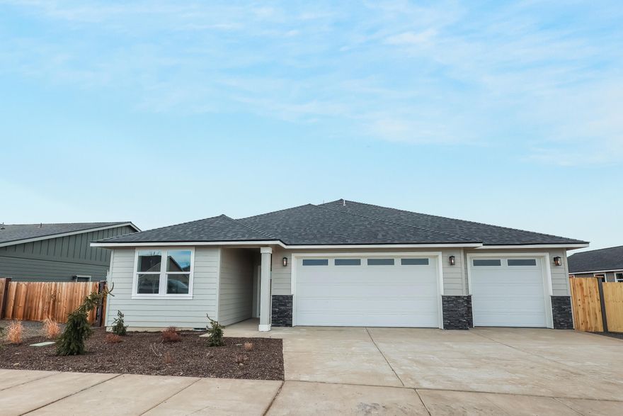 Now completed! Lot 18 features the Hamilton floorplan w/ Cascade Mtn views, 3 bdrms + den, 3 car garage & extra wide side area for RV/boat/toy with entrance gate. Upgraded finishes, tankless water heater & A/C included!  Primary bdrm features tray/box ceiling, XL walk-in closet, bathroom w/dual vanities, tile shower & enclosed toilet. Great separation from 2 guest bedrooms sharing a full bath. Entertain in your kitchen w/ SS appliances, pantry, tiled backsplash, soft-close cabinets, extensive slab quartz countertops opening to dining area & great room w/ gas burning fireplace & access to covered back patio. A spacious office/den & utility/laundry room too. Durable laminate plank flooring thru-out & carpeted bdrms. Fenced backyard & landscaping w/ sprinklers & entrance gate to side yard parking. *Floorplan subject to change. Some photos virtually staged.