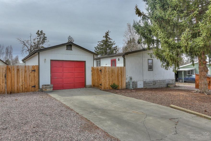 Well cared for home, close to schools and shopping. Utility room, pantry, fenced and landscaped yard, wood stove is certified and single car garage. Room for your RV!