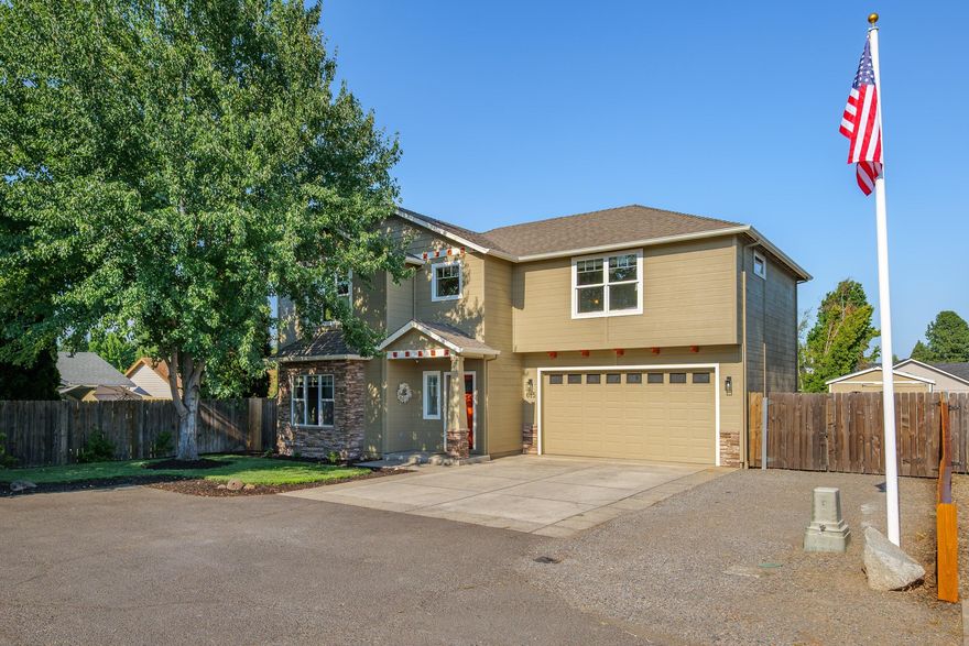 Welcome to this well-maintained 3 bed, 2.5 bath home in Central Point, offering 1,987 sq ft on a quiet dead-end street. Built in 2006, the home features solid wood cabinets, granite counters, and stainless steel appliances in a spacious kitchen. Upstairs you'll find all bedrooms plus the laundry room for added convenience. The primary suite includes a walk-in closet, soaking tub, stand-in shower, and dual vanities. The backyard is ideal for entertaining with a covered patio, salt water pool, and mature landscaping that creates a private, relaxing setting. RV parking and storage sheds add valuable utility, and the neighborhood is close to local schools, parks, and amenities. This home offers comfort, functionality, and the perfect setup for enjoying summer by the pool.