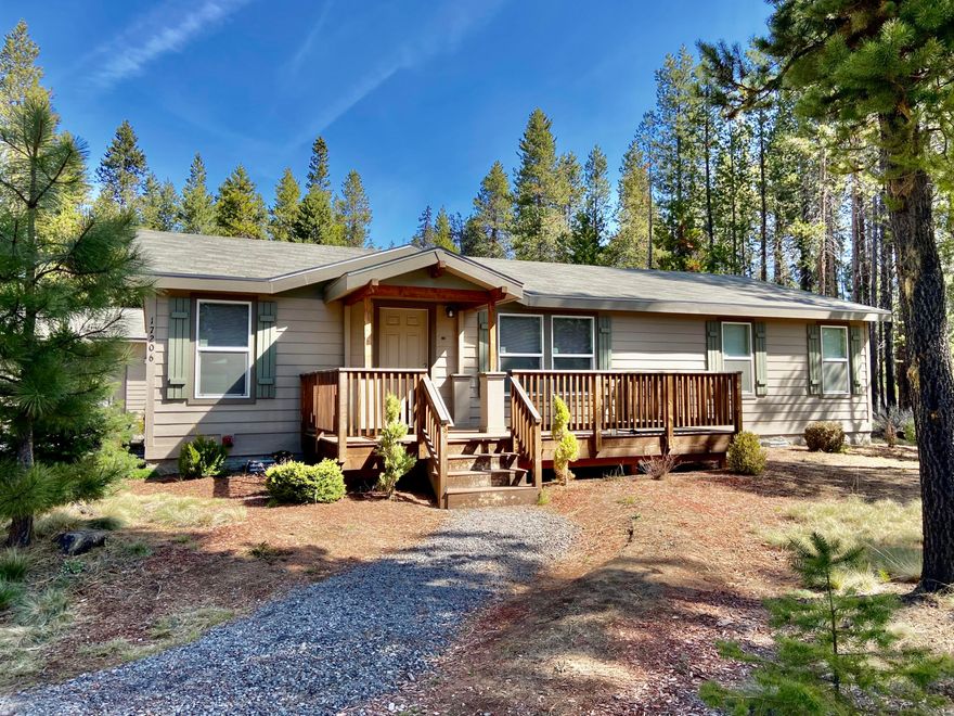 Convenient location just outside Sunriver off the road to Mt Bachelor and near the Deschutes river.  This move-in ready 3 bedroom 2 bath manufactured home built in 2017 is on a nicely treed almost half acre lot.  Open great room with vaulted ceiling.  Nice separation between primary bedroom and secondary bedrooms.  Large detached 864 +/- sq. ft. garage/shop.  Water filtration system.
